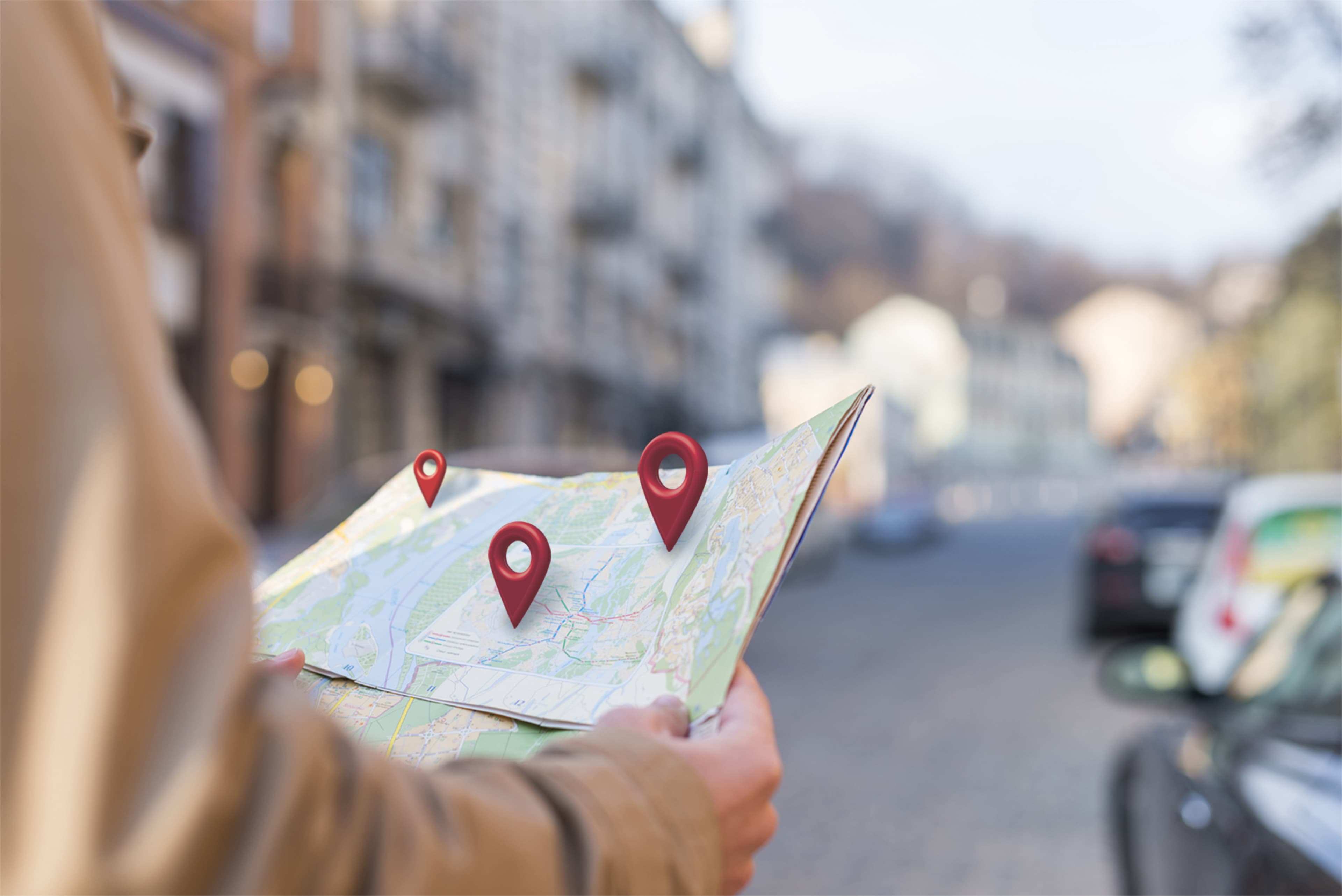 Side view of hands holding a map