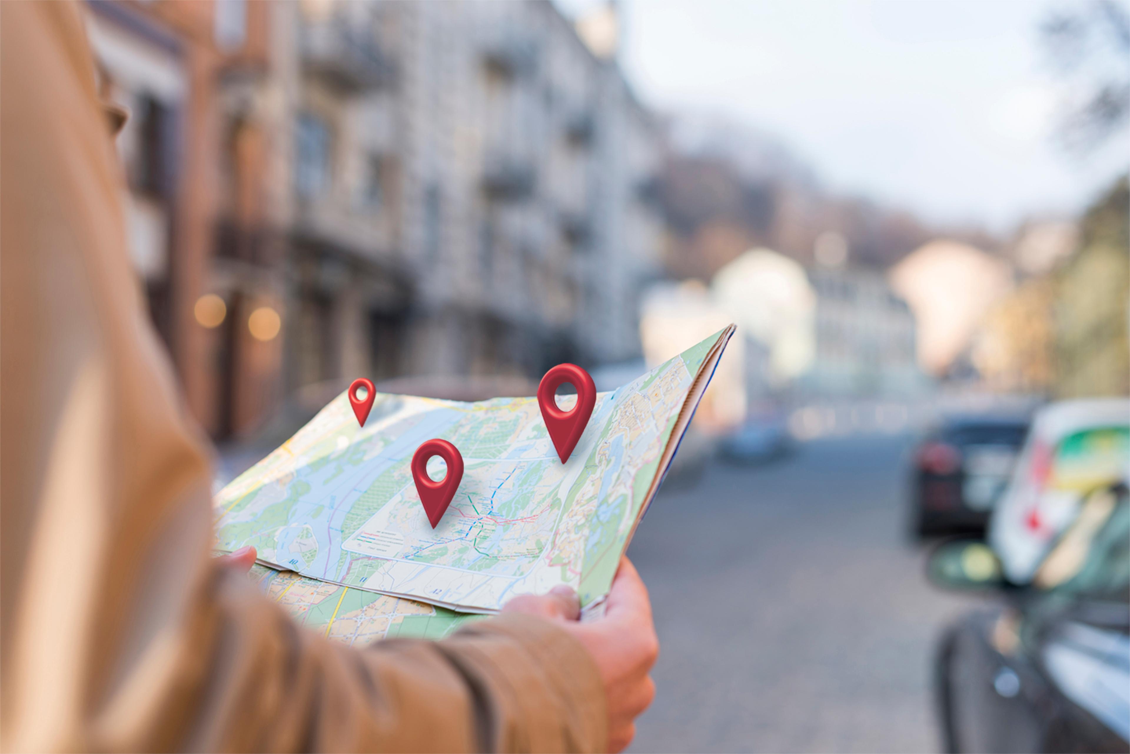 Side view of hands holding a map